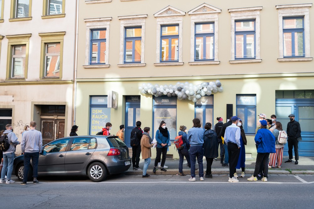 A group of people in front of a building